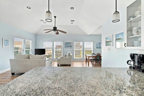 Granite island and the living room beyond