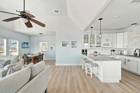 Open living room flowing into the kitchen and dining area