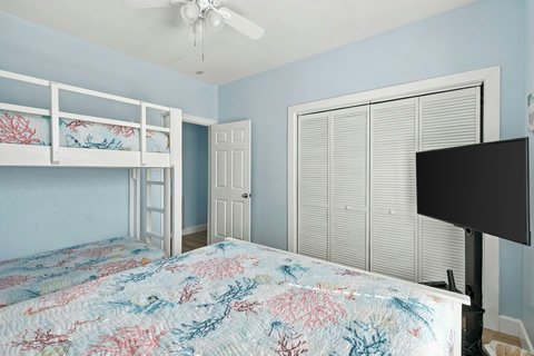 Bedroom with a closet and TV