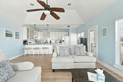 Sofas and kitchen bar in one open space
