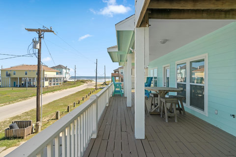 Long covered deck with a high-top table