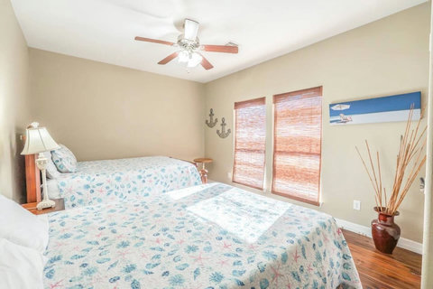 Two queen beds with sunny windows