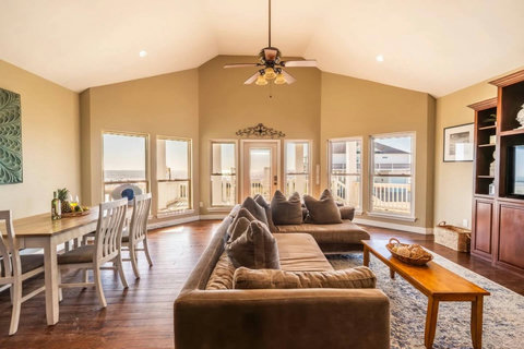 Big sectional and dining table with Gulf views