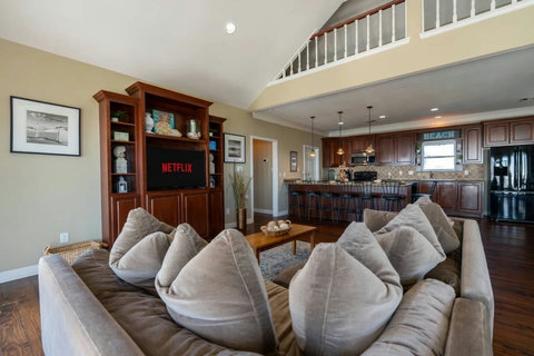 Living room open to the kitchen bar