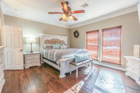 King bedroom with plenty of light