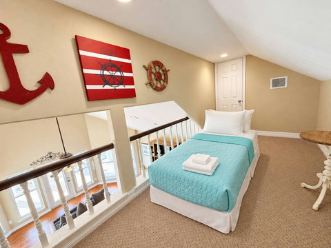 Loft above the kitchen with a twin bed