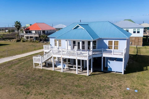 Beachfront house with a fenced yard