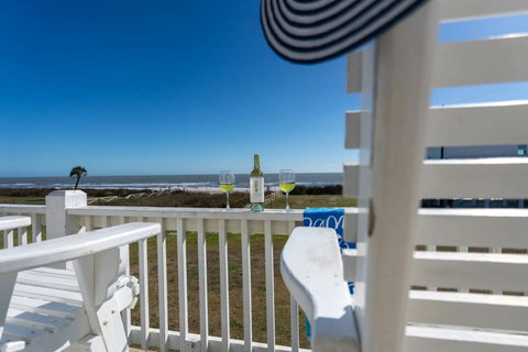 Wine on the rail with the Gulf behind it