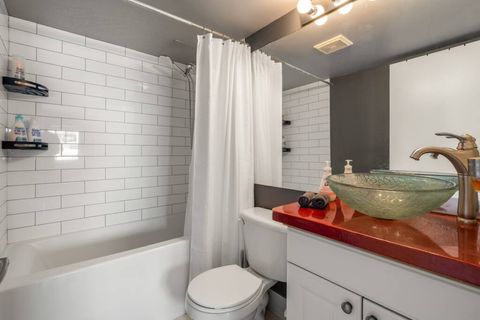 Bathroom with modern fittings and roomy design allowing for a truly invigorating cleanse.