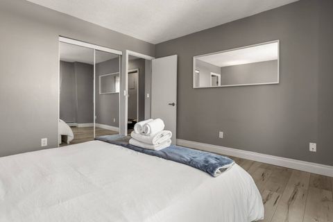 Awake to inspiring downtown vistas in our comfortable and stylish master suite.