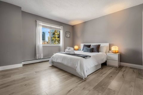 The master queen-size bedroom is a spacious sanctuary, complete with plush furnishings and sophisticated decor that fosters an atmosphere of tranquility.