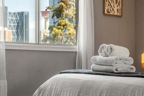 Wake up to a tranquil sleeping space with views of Calgary Downtown