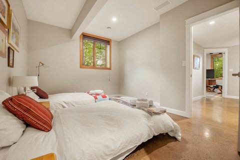 2nd bedroom with twin beds and walk-in closet.
