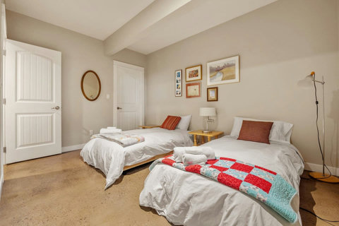 2nd bedroom with twin beds and walk-in closet.