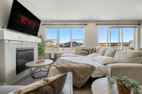 Beautiful cozy sofa bed with 65" Smart TV with Netflix to enjoy your favourite shows, movies  and more!