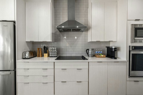 Modern and roomy fully equipped kitchen with knife set, keurig coffee machine (coffee pods included), tea, electric kettle, dishwasher, and more!