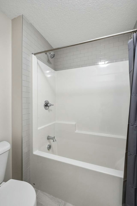 Full size bathtub with bidet toilet. Complimentary shampoo, condition and body wash.