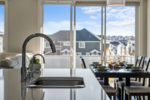 Modern and roomy fully equipped kitchen with knife set, keurig coffee machine (coffee pods included), tea, electric kettle, dishwasher, and more!
