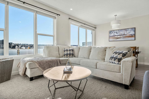 Cozy, luxurious & modern living room with a placce for everyone to connect, 65" Smart TV with Netflix shows, movies and more!