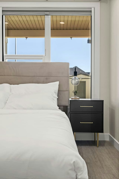 Beautiful cozy bedroom with quality mattress, duvet and complete towel sets.