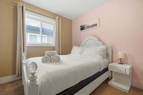 Drift off in comfort with our comfortable bed, outfitted with fresh, plush bedding and accented by modern dimmable night lamps.
