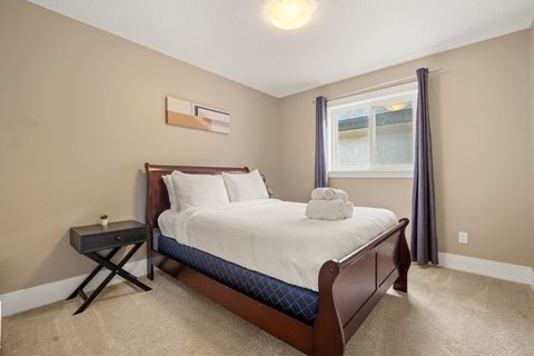 Drift off in comfort with our comfortable bed, outfitted with fresh, plush bedding and accented by modern dimmable night lamps.