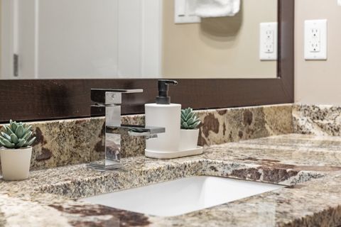 Full Bathroom equipped with complementary Q-Tips, facial tissues, make up removal cloth and full bathtub