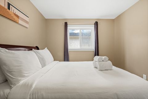 Drift off in comfort with our comfortable bed, outfitted with fresh, plush bedding and accented by modern dimmable night lamps.