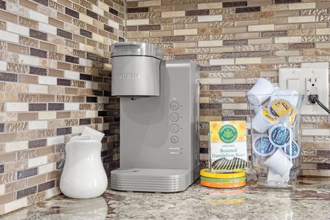 Fully-equipped kitchen, boasting a ice maker, modern appliances, and a coffee machine for your morning brew.