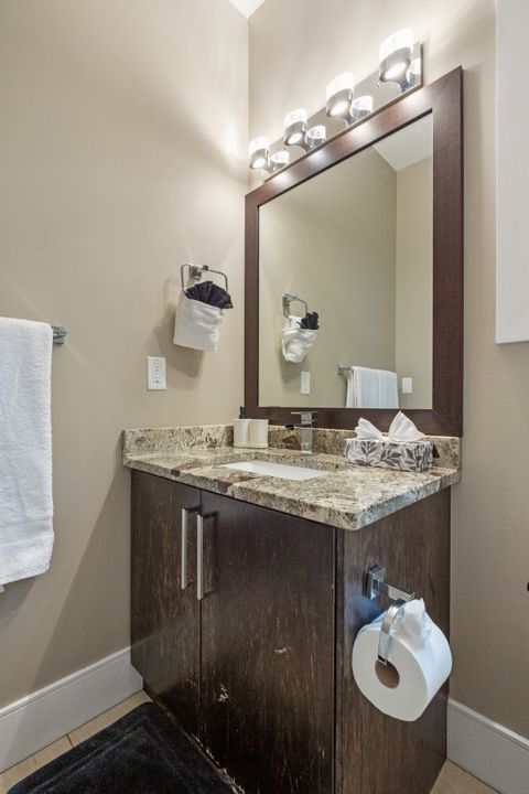 Main Floor Full Bathroom equipped with complementary Q-Tips, facial tissues, make up removal cloth and full bathtub