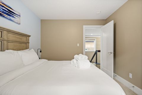 Drift off in comfort with our comfortable bed, outfitted with fresh, plush bedding and accented by modern dimmable night lamps.