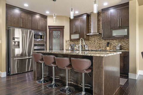 Fully-equipped kitchen, boasting a ice maker, modern appliances, and a coffee machine for your morning brew.