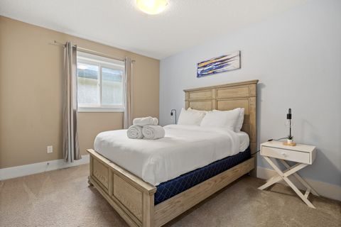 Drift off in comfort with our comfortable bed, outfitted with fresh, plush bedding and accented by modern dimmable night lamps.