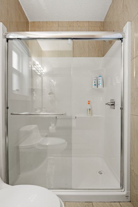 Main Floor Full Bathroom equipped with complementary Q-Tips, facial tissues, make up removal cloth and full bathtub