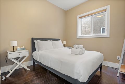 Drift off in comfort with our comfortable main floor bed, outfitted with fresh, plush bedding and accented by modern dimmable night lamps.