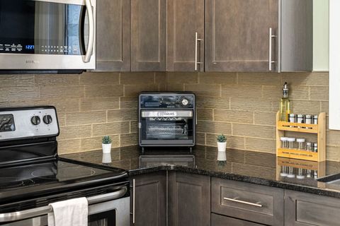 Fully-equipped kitchen, boasting a Air Fryer, modern appliances, and a coffee machine for your morning brew.