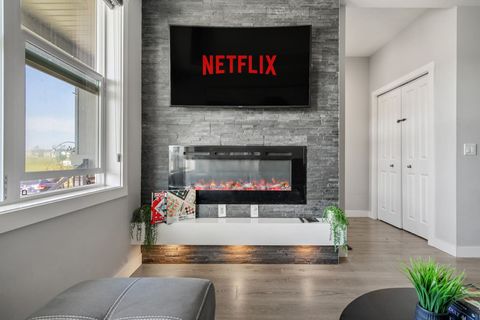 Enjoy Warmth and Ambiance with Our Stylish Fireplace in the Living Room with Smart TV