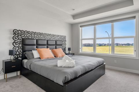 Restful Nights In Our Generously Sized King Bedroom Dark Linens and Ample Space