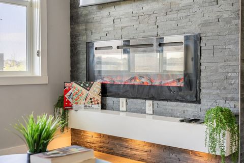 Relax in the Glow of the Fireplace in Our Elegant Living Room Setting