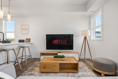 Unwind in the spacious living room, complete with a smart TV, a futon sofa bed, and an additional foldable twin cot stored in the closet, allowing the space to sleep up to 6 guests. Extra memory foam padding is available for maximum comfort, making it the