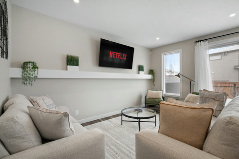 Stylish living room featuring smart TV and cozy seating for relaxation