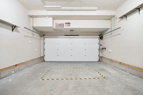 Spacious garage offering secure parking and storage space.