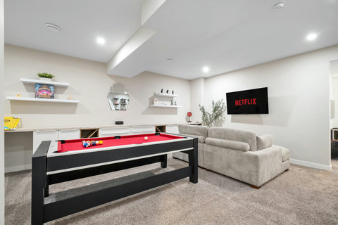 Spacious recreation room featuring billiards table and flat-screen entertainment