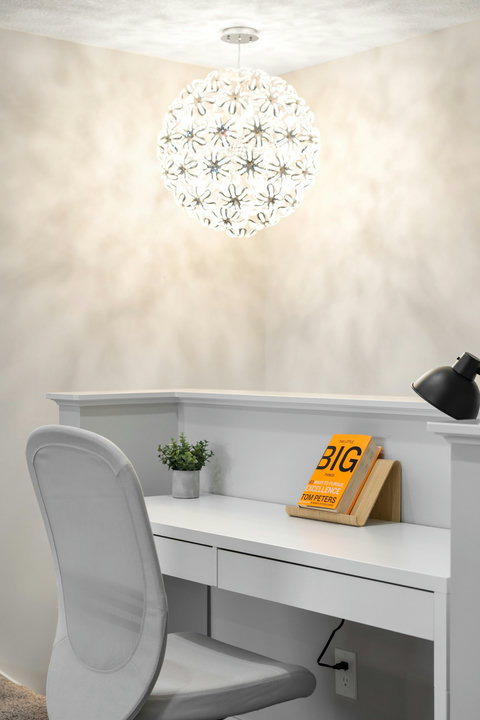 Bright, inspiring home office nook with designer pendant light