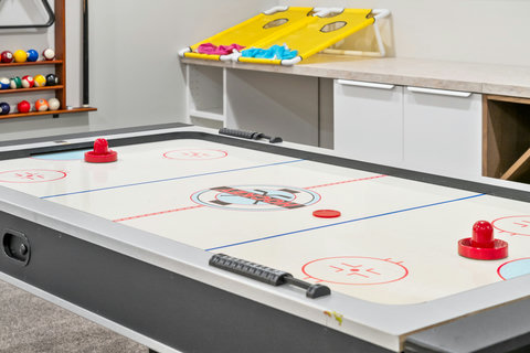 Fun-filled game room with air hockey table for family entertainment