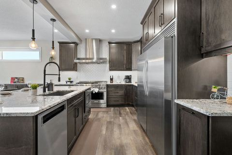 Chef's kitchen with beautiful island, premium stainless appliances and granite countertops