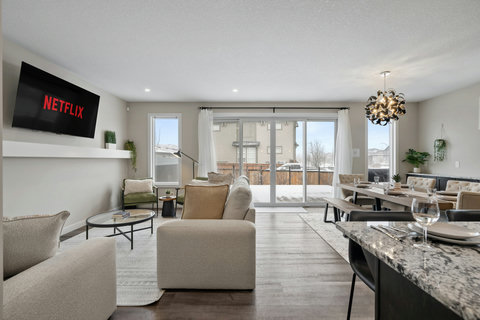 Spacious living room with comfortable seating and access to your private balcony