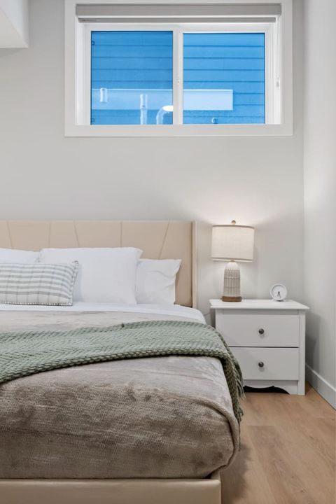 Master bedroom with a 50" Smart TV, plush towels, linens and a cozy mattress.
