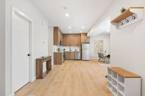 Large living area with a coat rack, console table to keep your keys organized.