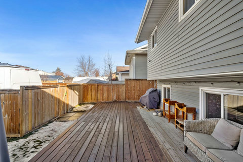 Large backyard deck perfect for outdoor entertaining and relaxation